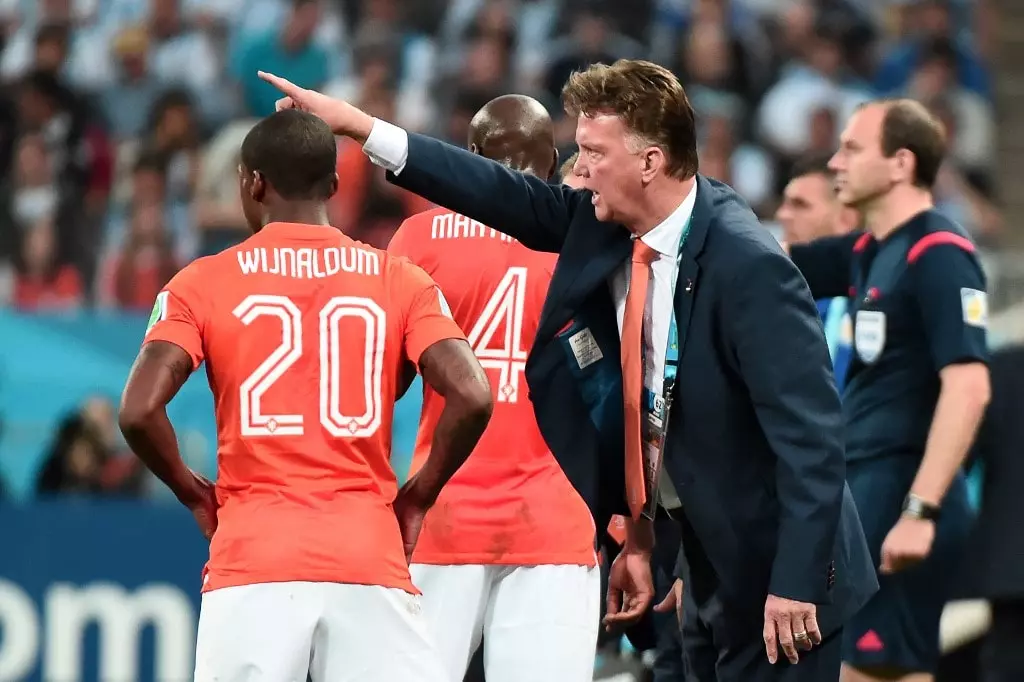 Netherlands' coach Louis van Gaal (R) gestures during the semi-final football match between Netherlands and Argentina of the FIFA World Cup at The Corinthians Arena in Sao Paulo on July 9, 2014.