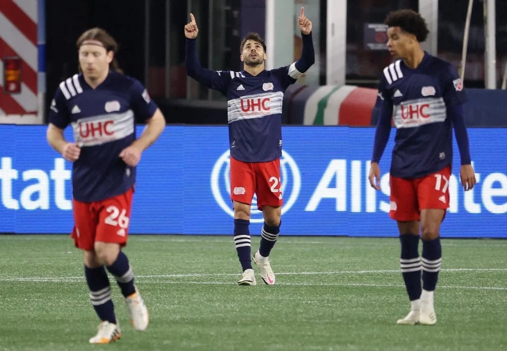 Carles Gil #22 of New England Revolution celebrates after scoring a goal against the Montreal Impact during the Play-In Round match of the MLS Cup Playoffs