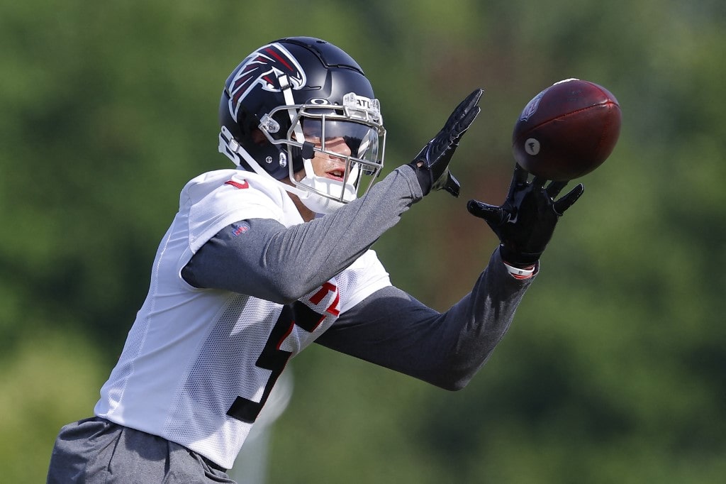 Drake London #5 of Atlanta Falcons catches a pass during a training camp practice