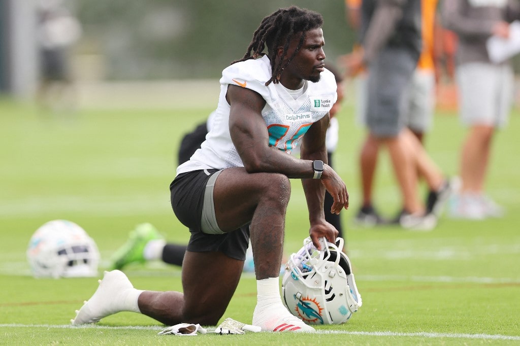 Tyreek Hill #10 of the Miami Dolphins looks on during training camp at Baptist Health