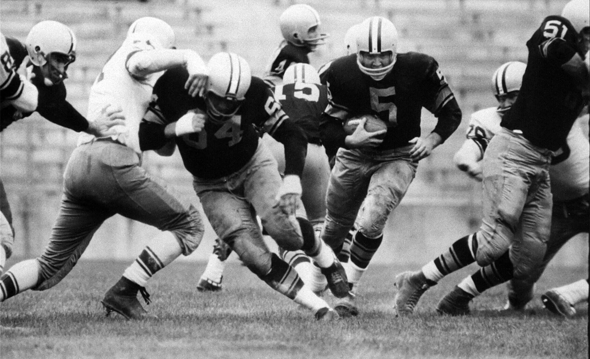 Hornung (No. 5) breaks through the line during an intra-squad preseason game in August 1959.