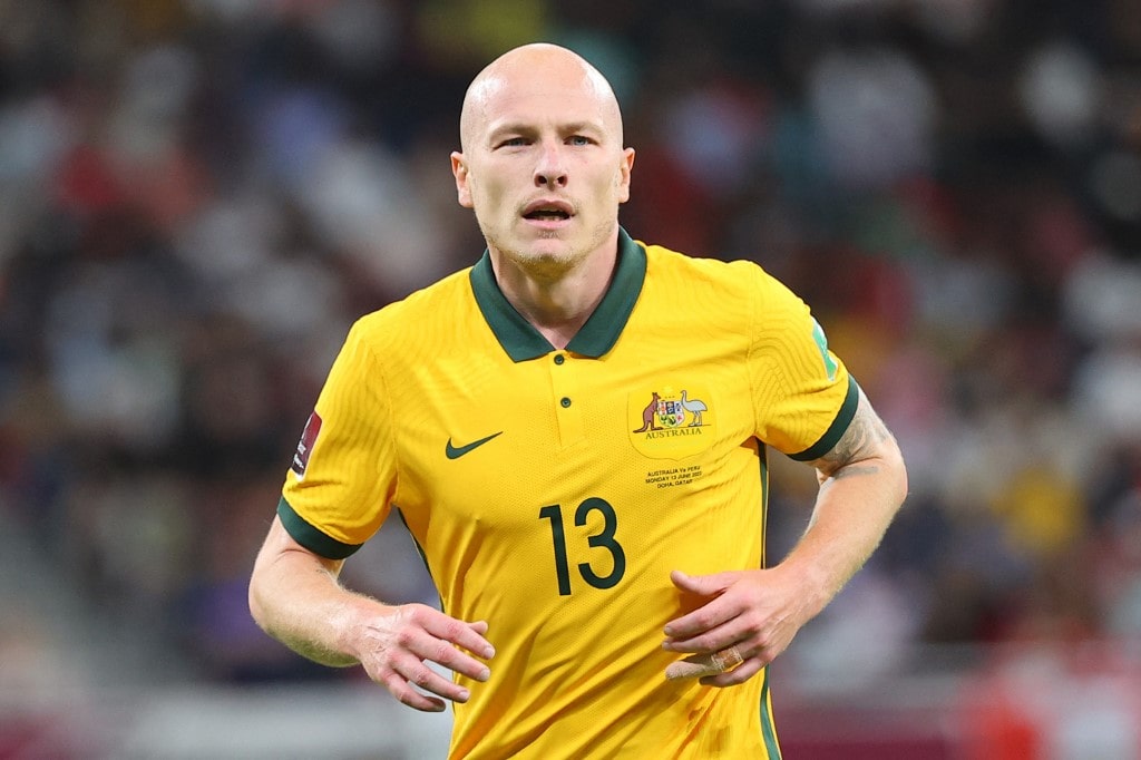 Australia's midfielder Aaron Mooy jogs during the FIFA World Cup 2022 inter-confederation play-offs match between Australia and Peru