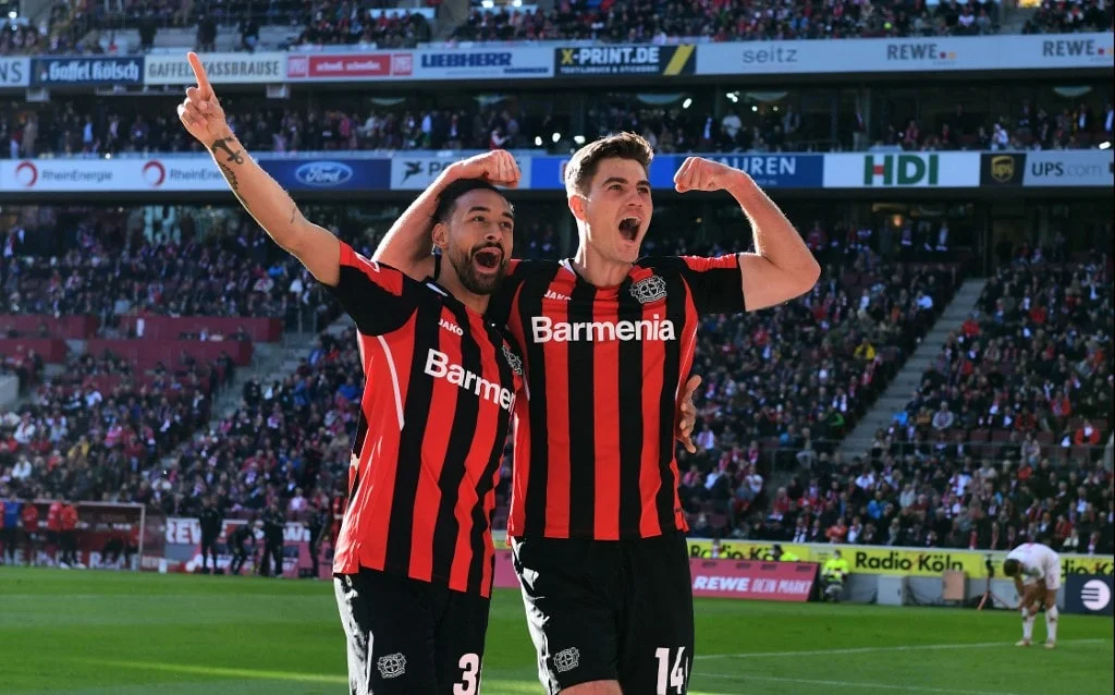 Leverkusen's Czech forward Patrik Schick (R) and Leverkusen's German midfielder Karim Bellarabi celebrate scoring
