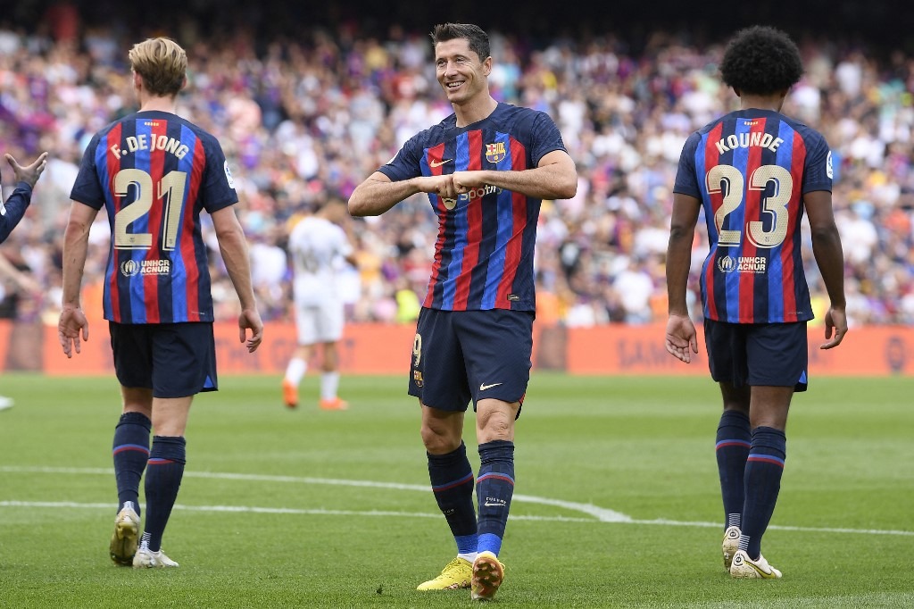 Barcelona's Polish forward Robert Lewandowski celebrates scoring his team's third goal during the Spanish League football match