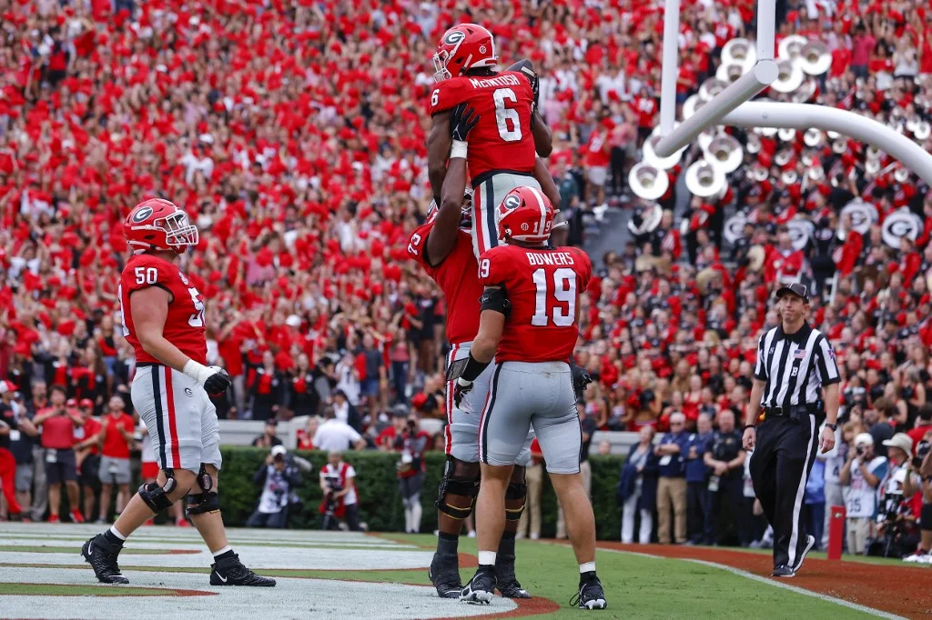Kenny McIntosh #6 of the Georgia Bulldogs reacts after a touchdown in the first half against the Samford Bulldogs at Sanford Stadium on September 10, 2022