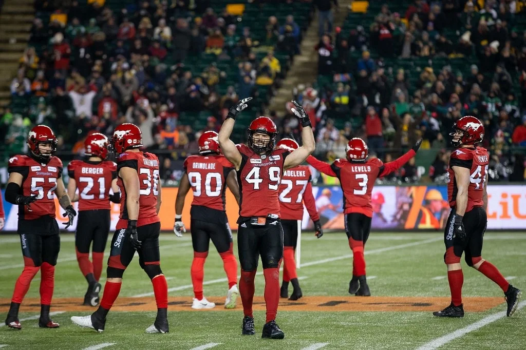 Alex Singleton #49 of the Calgary Stampeders pumps up the crowd while playing against the Ottawa Redblacks
