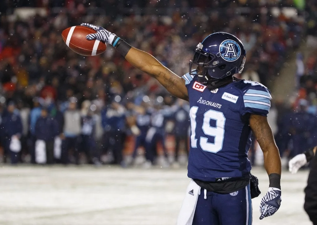 S.J. Green of the Toronto Argonauts reaches forward with the ball