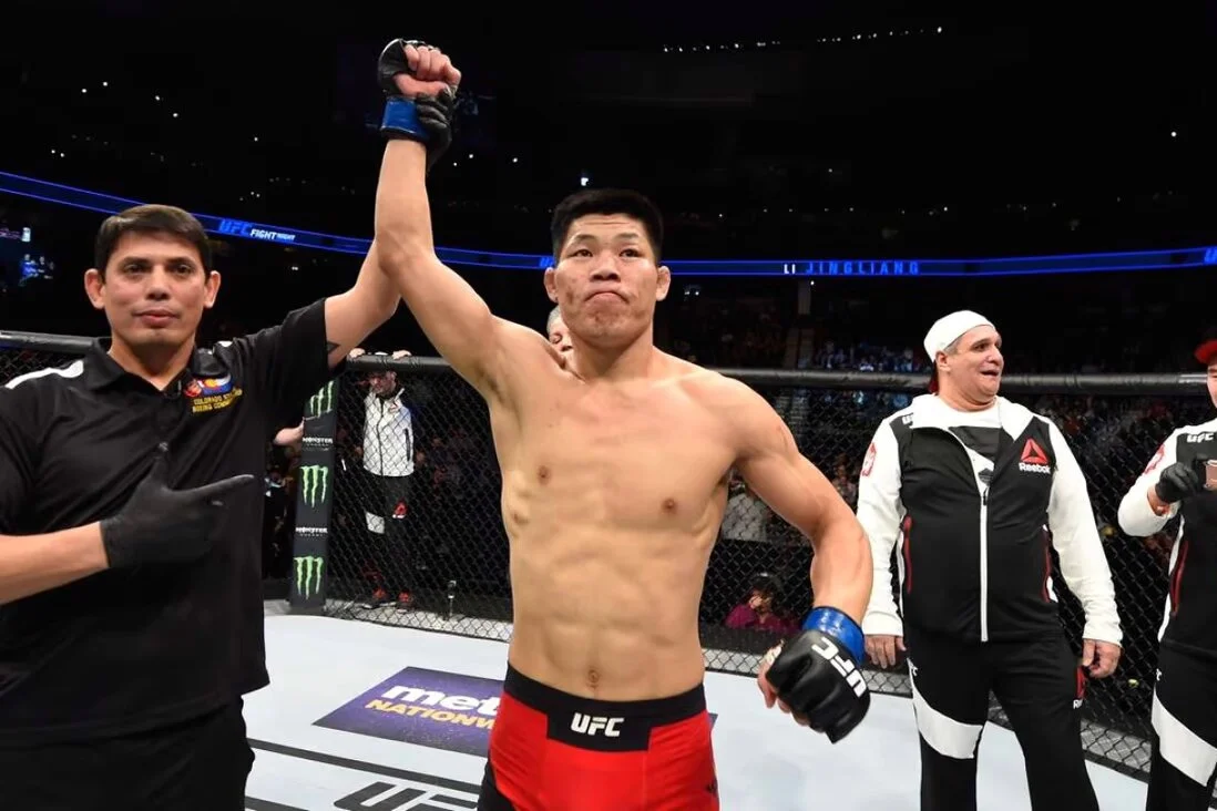 Li Jingliang celebrates his UFC win over Bobby Nash.