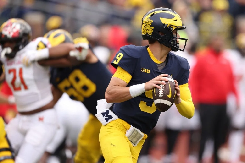 J.J. McCarthy #9 of the Michigan Wolverines looks to throw a second half pass