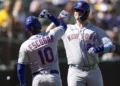 Pete Alonso #20 and Eduardo Escobar #10 of the New York Mets celebrate