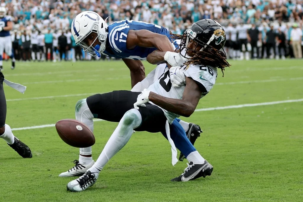 Mike Strachan #17 of the Indianapolis Colts is tackled by Shaquill Griffin #26 of the Jacksonville Jaguars