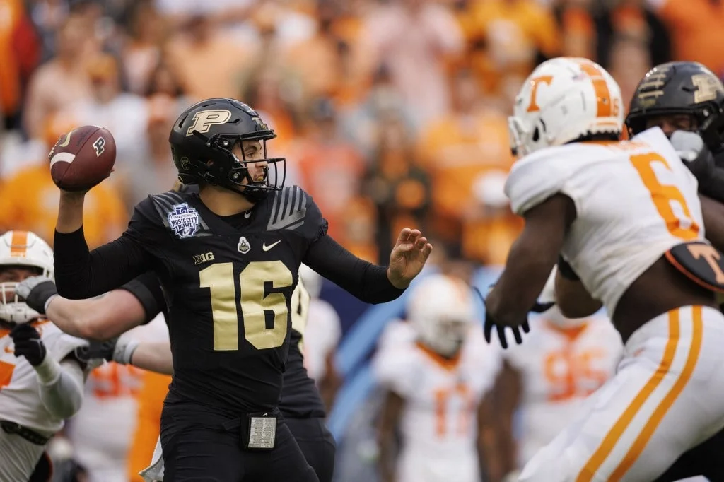 Aidan O'Connell #16 of the Purdue Boilermakers passes the ball
