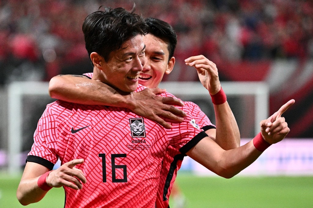 South Korea's Hwang Ui-jo (front) celebrates his goal during the international football friendly match between South Korea and Brazil