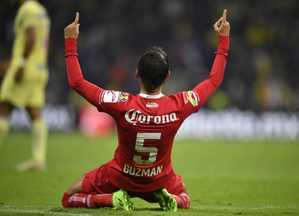 Toluca's Carlos Guzman celebrates after defeating America during their Mexican Apertura football tournament semifinal match
