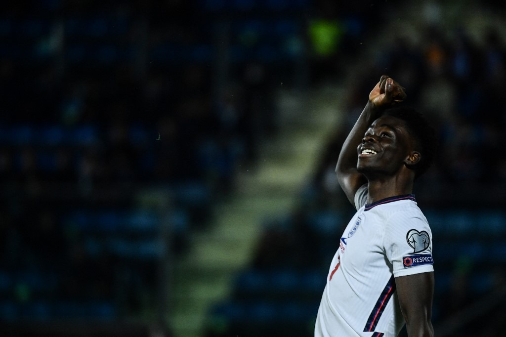 England's midfielder Bukayo Saka celebrates after scoring