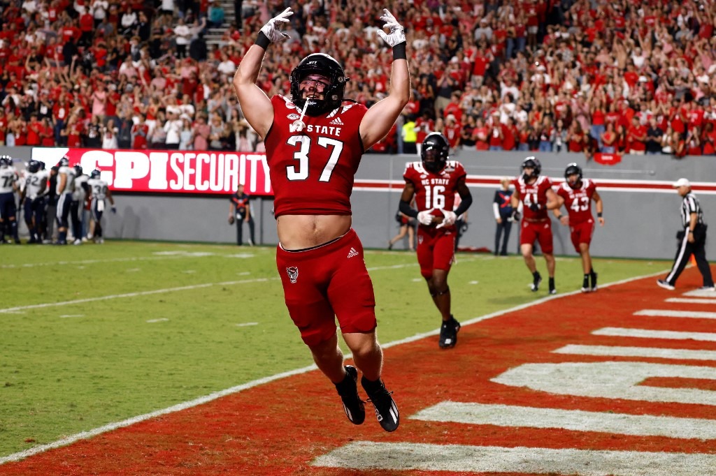 Nicholas Treco #37 of the North Carolina State Wolfpack pumps up the crowd during the match