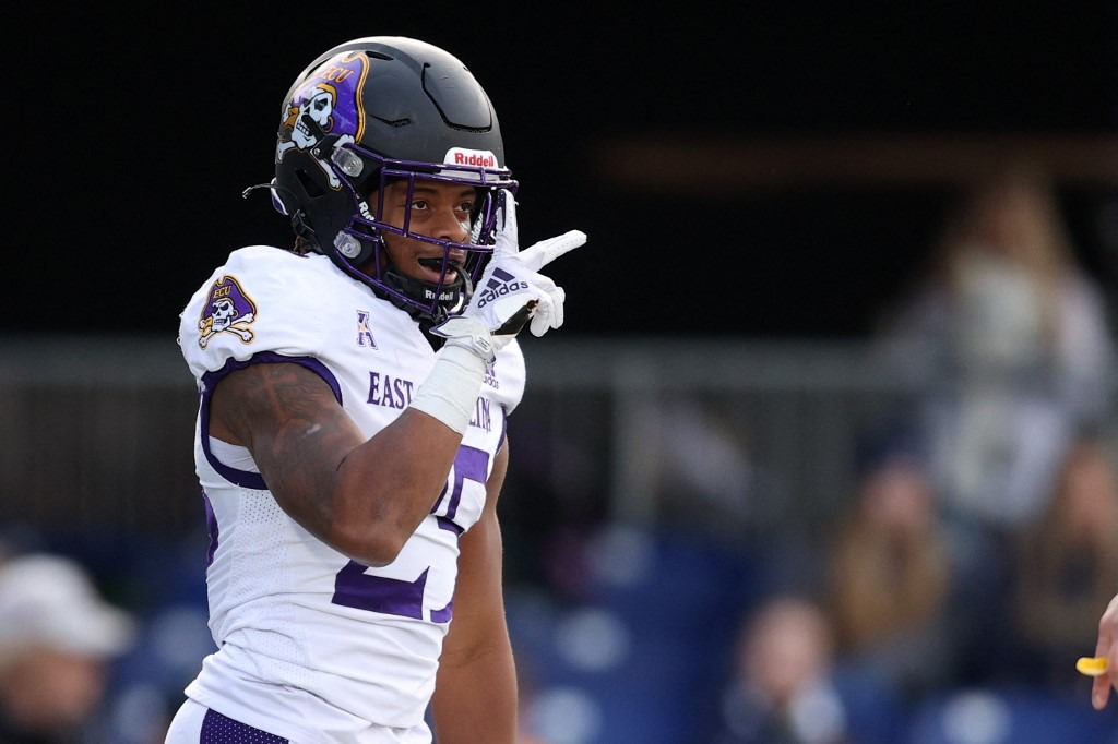 Keaton Mitchell #25 of the East Carolina Pirates celebrates his touchdown against the Navy Midshipmen