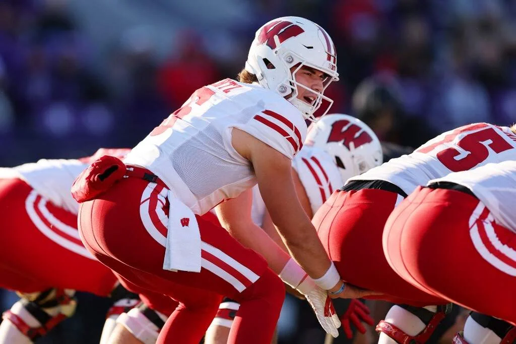 Graham Mertz #5 of the Wisconsin Badgers looks on