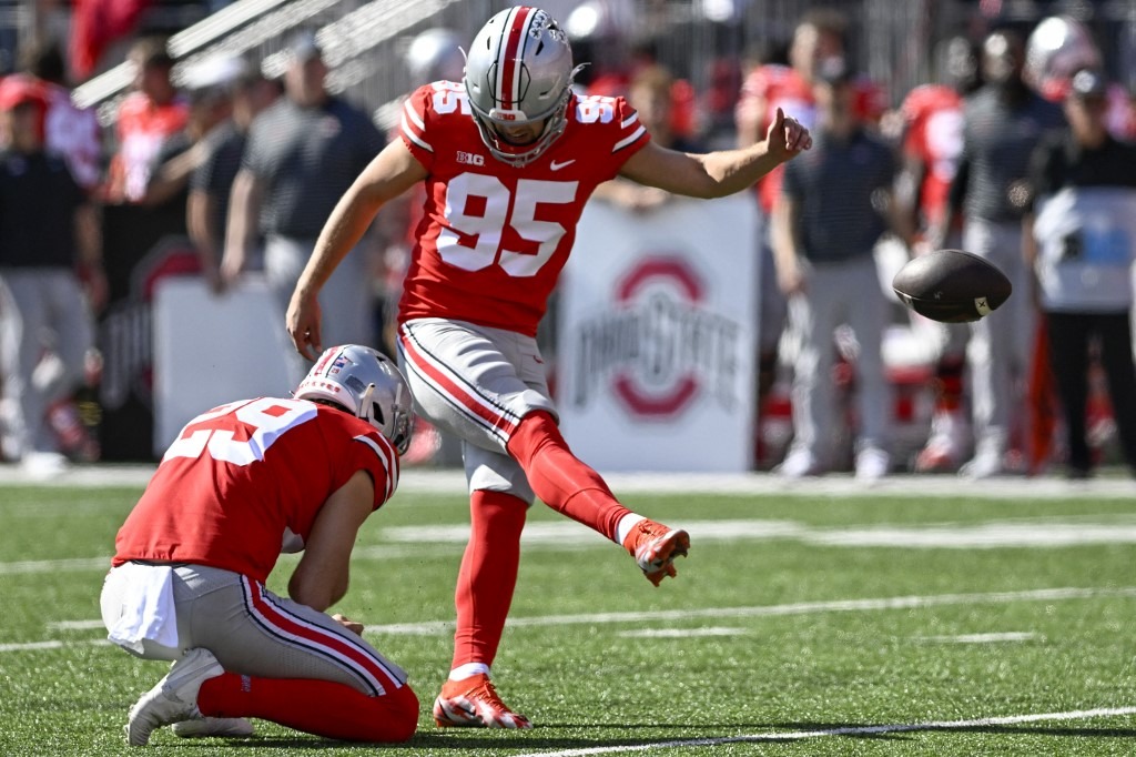 Kicker Noah Ruggles #95 of the Ohio State Buckeyes kicks a field goal in the second quarter against the Iowa Hawkeyes