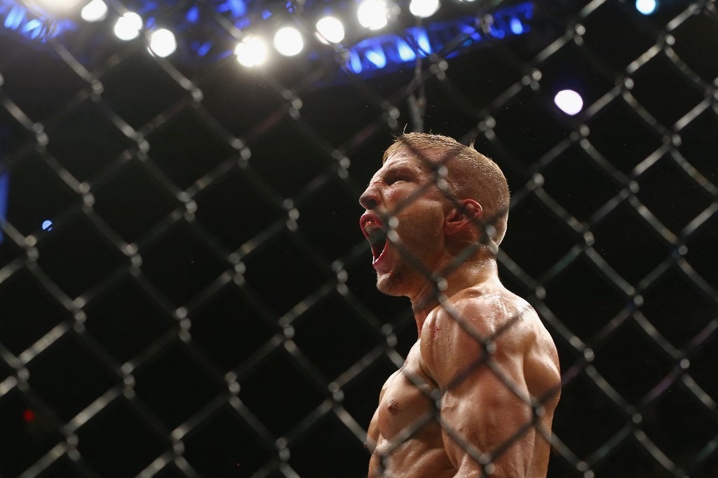 TJ Dillashaw reacts during his UFC bantamweight championship bout against Cody Garbrandt during the UFC 217