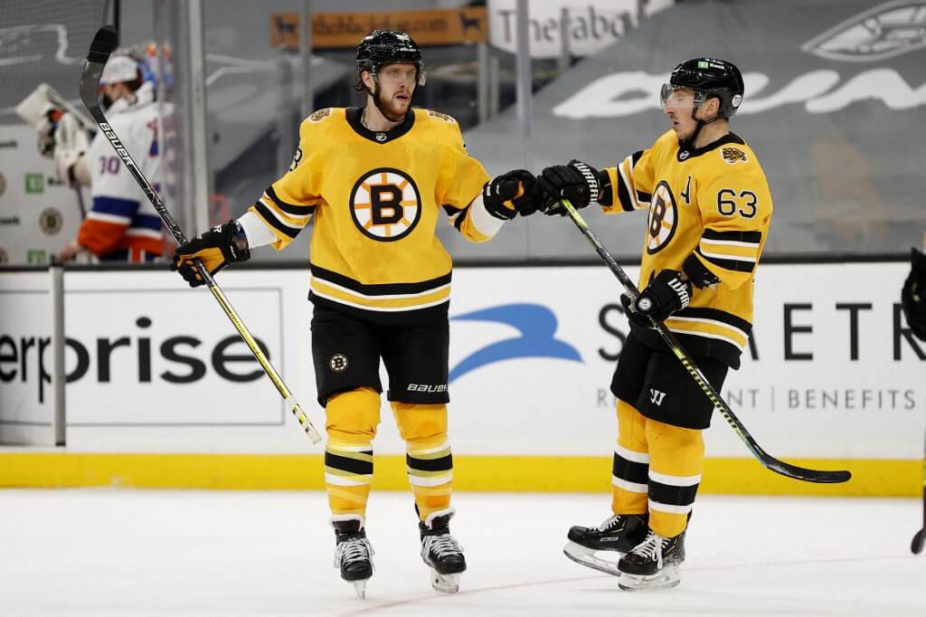 Brad Marchand #63 and David Pastrnak #88 of the Boston Bruins