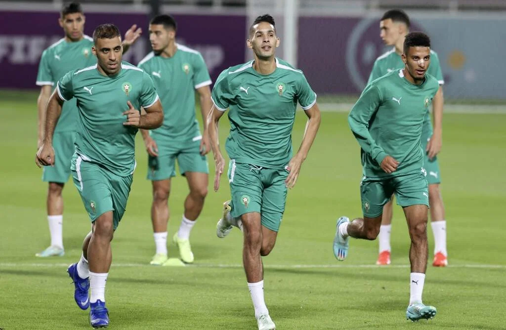 Morocco's forward Abderrazak Hamdallah, Morocco's defender Badr Banoune and Morocco's midfielder Azzedine Ounahi jog