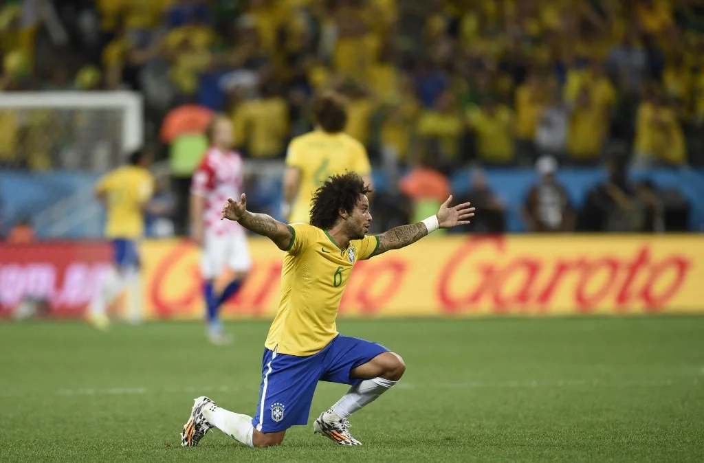 Brazil's defender Marcelo celebrates during a Group A football match between Brazil and Croatia at the Corinthians Arena in Sao Paulo during the 2014 FIFA World Cup on June 12, 2014