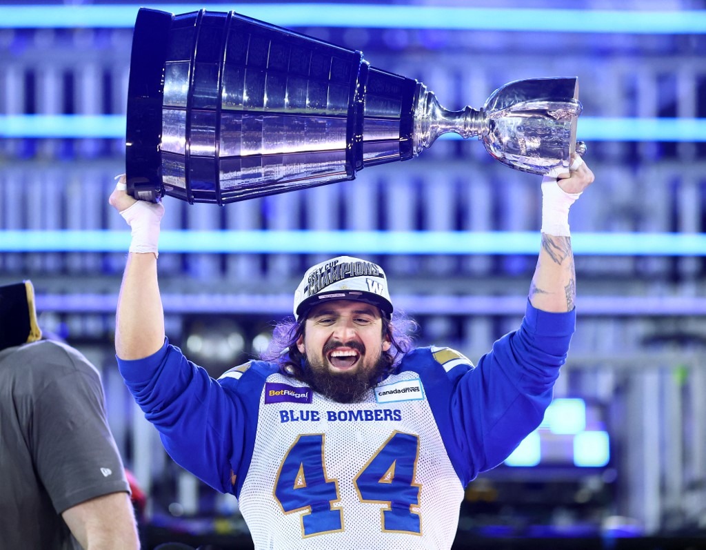 Shayne Gauthier #44 of the Winnipeg Blue Bombers celebrate their victory with the Grey Cup