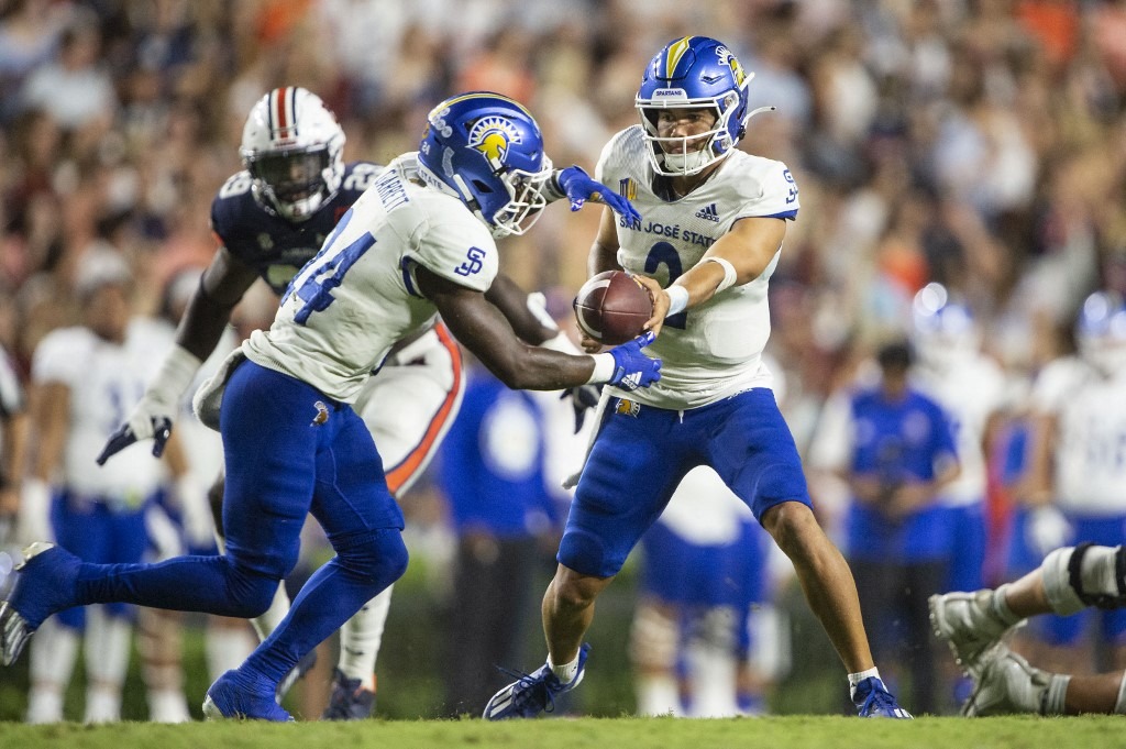 Quarterback Chevan Cordeiro #2 of the San Jose State Spartans looks the hand the ball