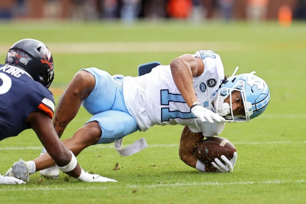Josh Downs #11 of the North Carolina Tar Heels slips