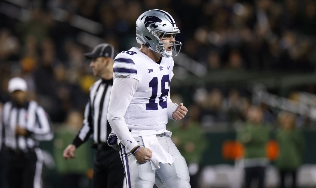 Will Howard #18 of the Kansas State Wildcats celebrates after throwing a touchdown pass against the Baylor Bears