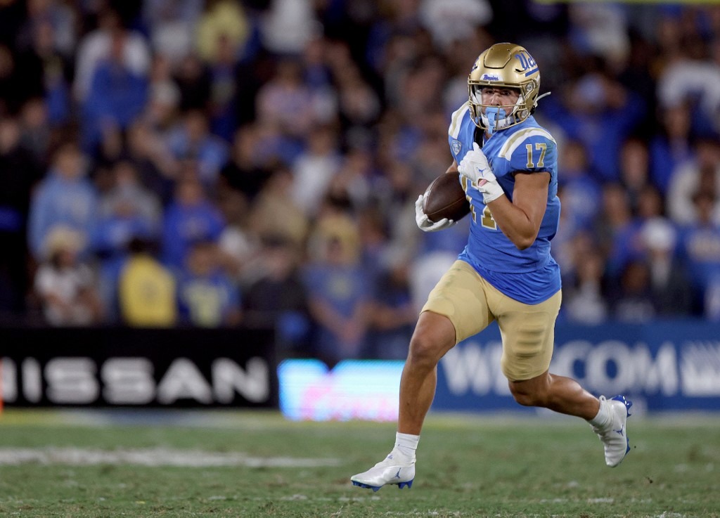 Logan Loya #17 of the UCLA Bruins runs after his catch
