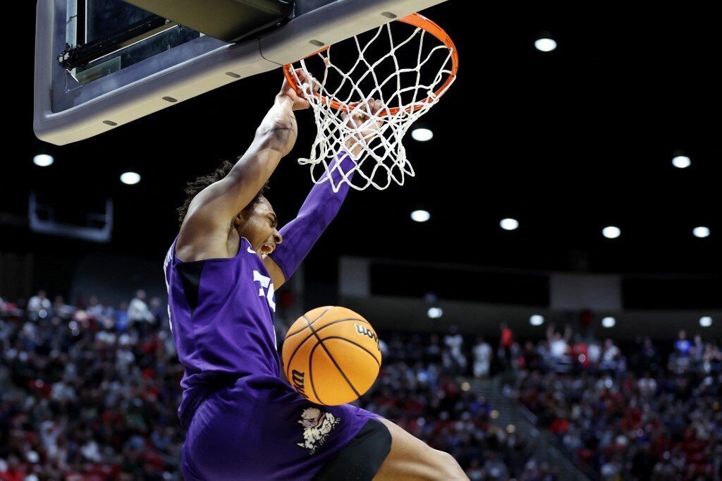 Chuck O'Bannon Jr. #5 of the TCU Horned Frogs dunks the ball