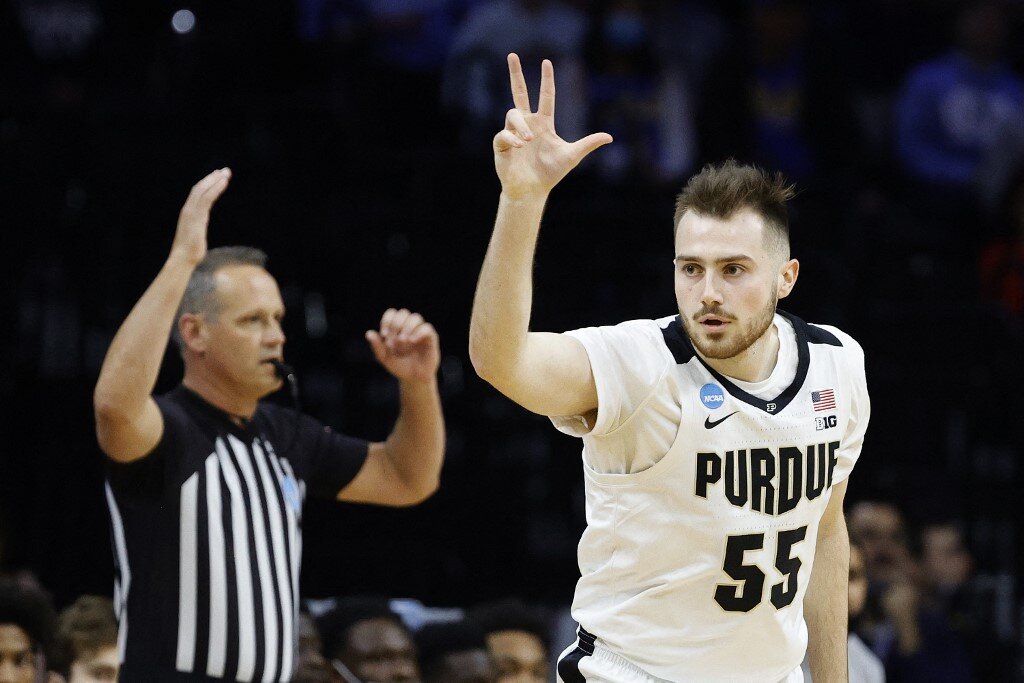 Sasha Stefanovic #55 of the Purdue Boilermakers reacts to making a three-point shot