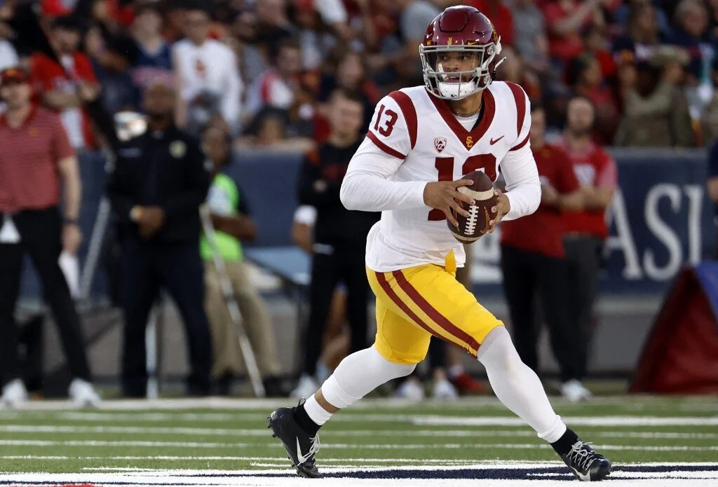 Quarterback Caleb Williams #13 of the USC Trojans runs