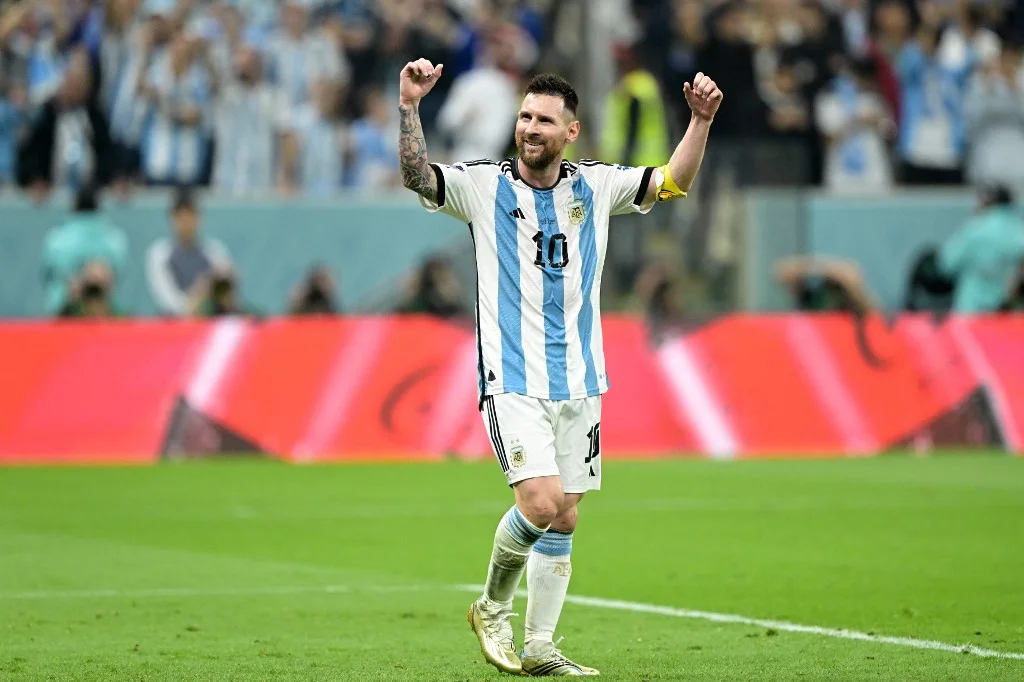 Argentina's forward #10 Lionel Messi reacts after forward #09 Julian Alvarez scored his team's third goal during the Qatar 2022 World Cup football semi-final match between Argentina and Croatia at Lusail Stadium in Lusail, north of Doha on December 13, 202