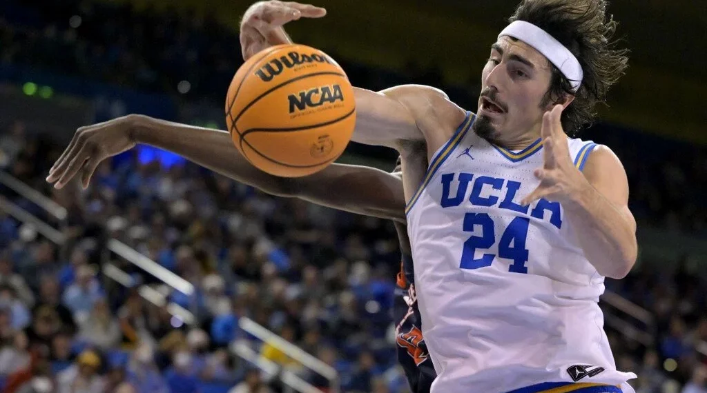 Jaime Jaquez Jr. #24 of the UCLA Bruins reaches in front