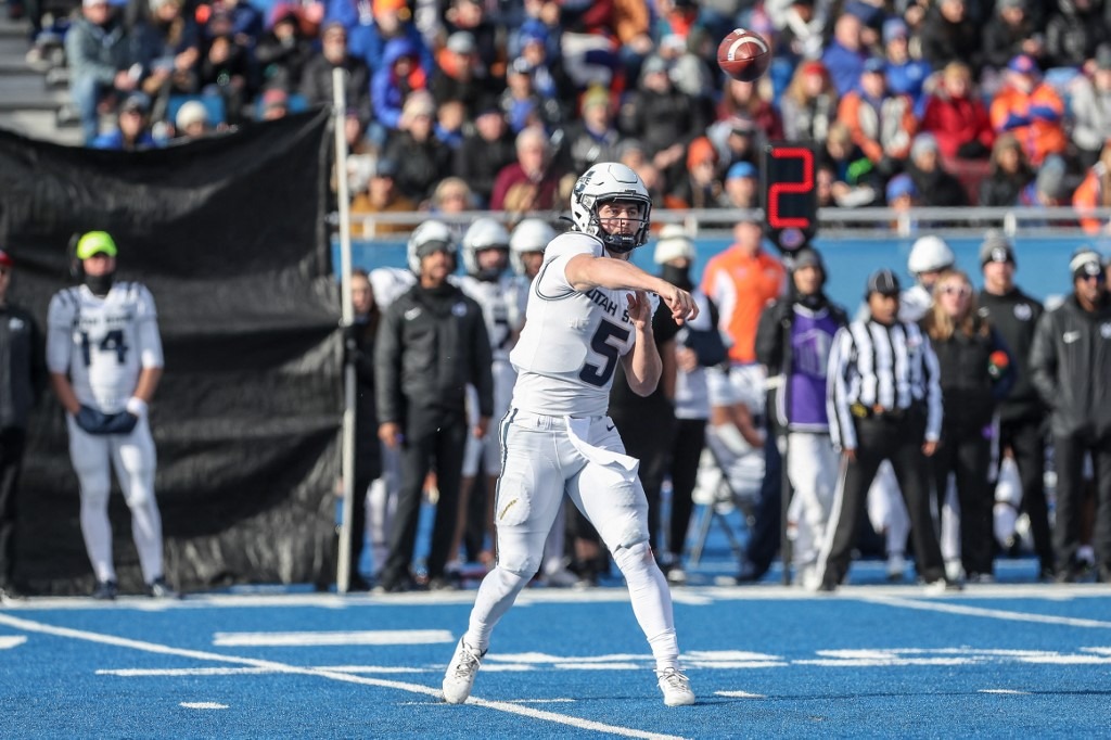 Quarterback Cooper Legas #5 of the Utah State Aggies passes the ball during first half action against the Boise State Broncos