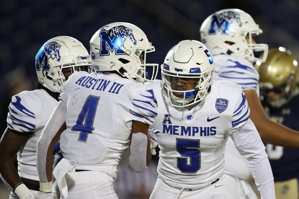 Wide receiver Calvin Austin III #4 of the Memphis Tigers celebrates with teammates after scoring a touchdown against the Navy Midshipmen