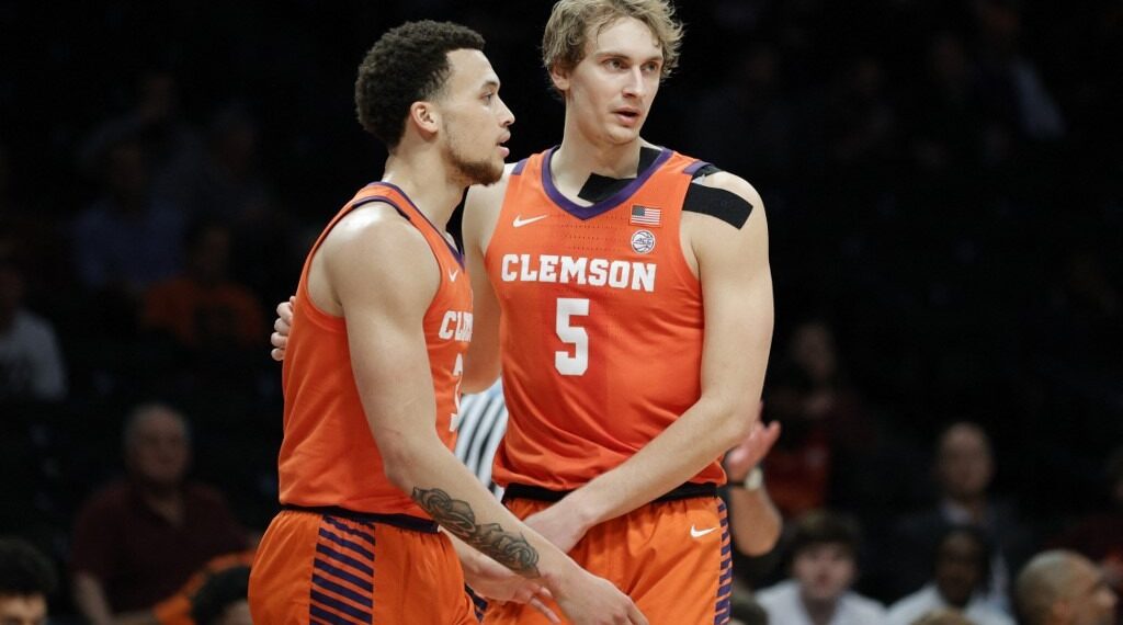Chase Hunter #3 and Hunter Tyson #5 of the Clemson Tigers react during the first half in the 2022 Men's ACC Basketball Tournament