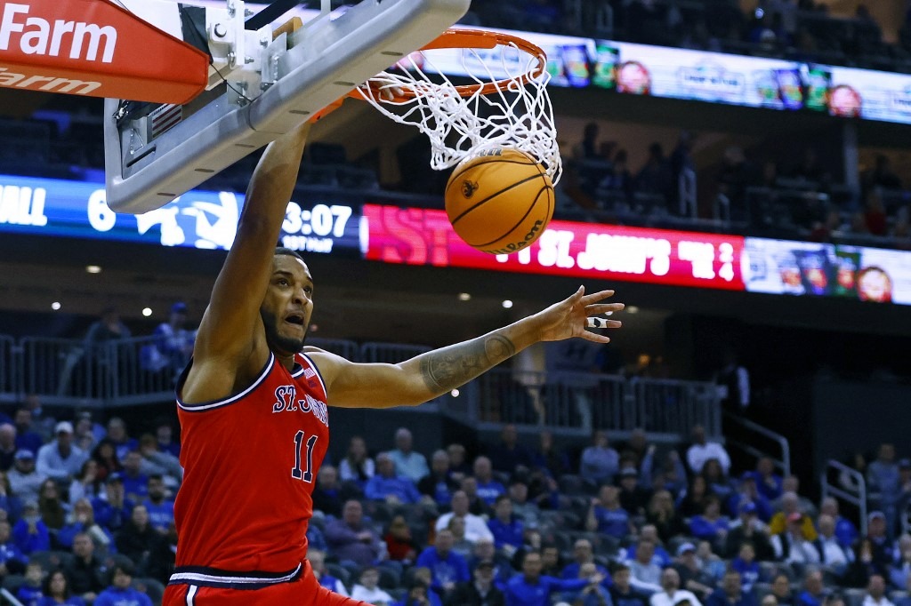 Joel Soriano #11 of the St. John's Red Storm dunks against the Seton Hall Pirates for a rebound during the first half of a game at Prudential Center