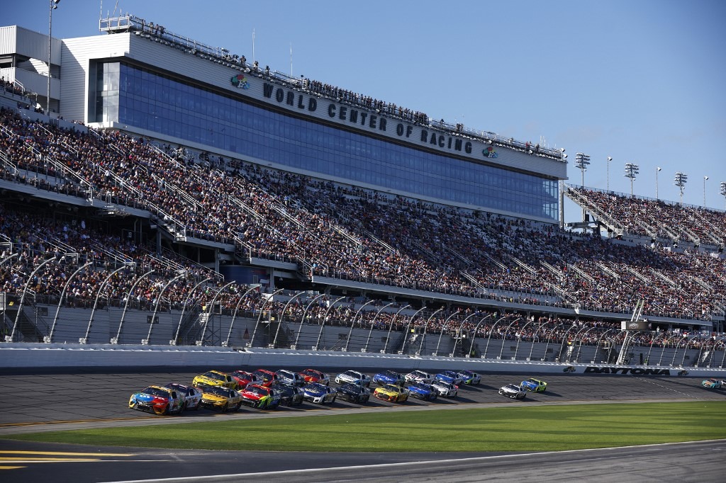 Kyle Busch, driver of the #18 M&M's Toyota, leads the field during the NASCAR Cup Series 64th Annual Daytona 500 at Daytona International Speedway on February 20, 2022
