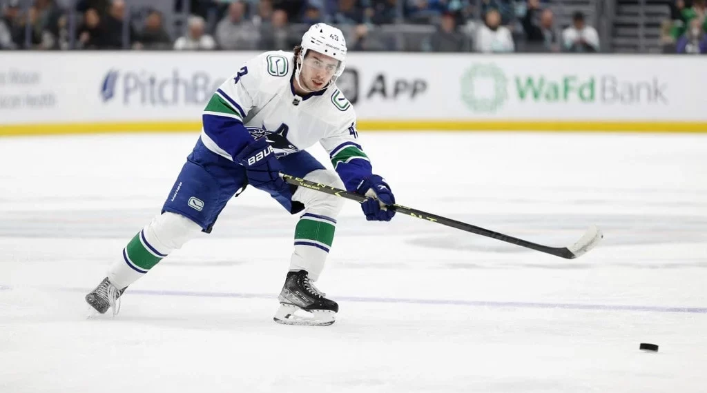 Quinn Hughes #43 of the Vancouver Canucks skates against the Seattle Kraken