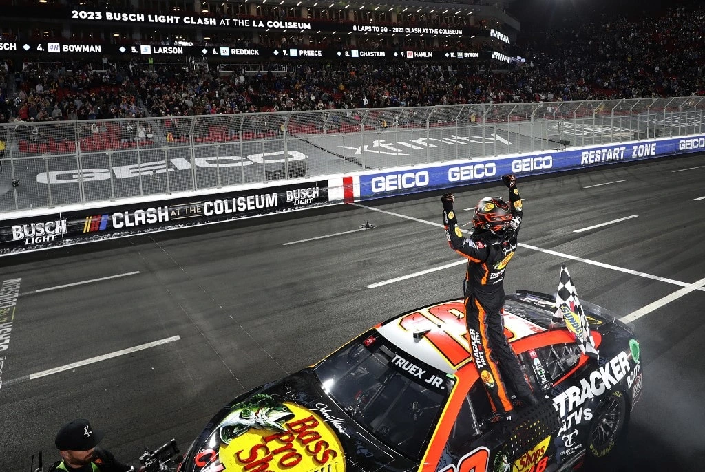 Martin Truex Jr., driver of the #19 Bass Pro Shops Toyota, celebrates after winning the NASCAR Clash at the Coliseum at Los Angeles Memorial Coliseum on February 05, 2023