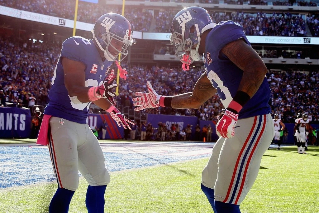 Wide receiver Odell Beckham #13 of the New York Giants celebrates with wide receiver Victor Cruz #80