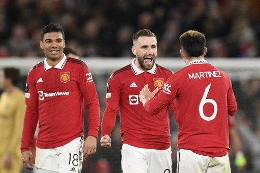 Manchester United celebrate at the end of the UEFA Europa league - Oli scarff / AFP