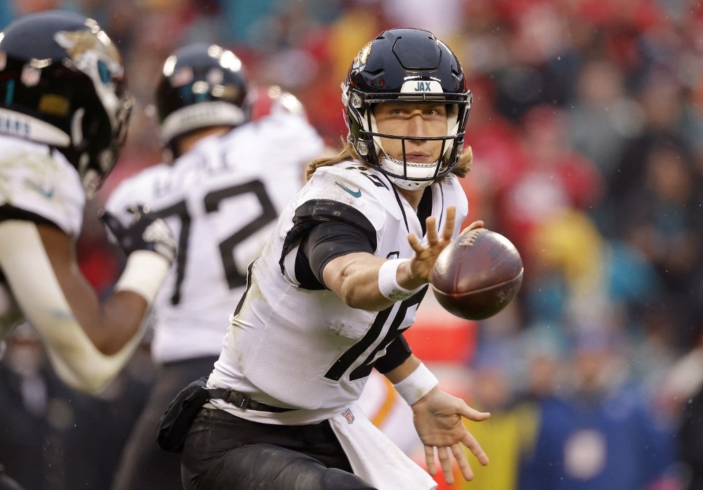 Trevor Lawrence #16 of the Jacksonville Jaguars flicks the ball against the Kansas City Chiefs