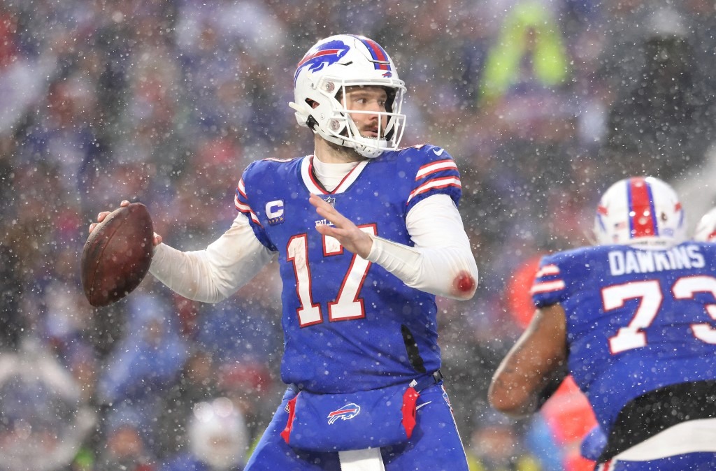 Josh Allen #17 of the Buffalo Bills looks to pass against the Cincinnati Bengals during the third quarter in the AFC Divisional Playoff game