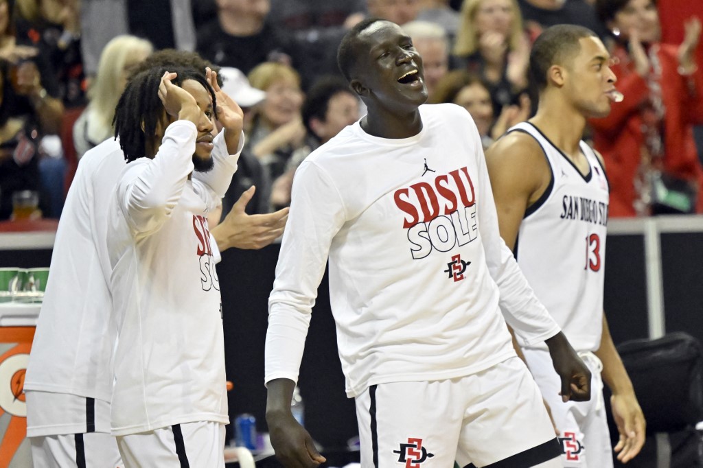 Aguek Arop #33, (C) of the San Diego State Aztecs cheers during the second half of a semifinal game against the San Jose State David Becker/Getty Images/AFP