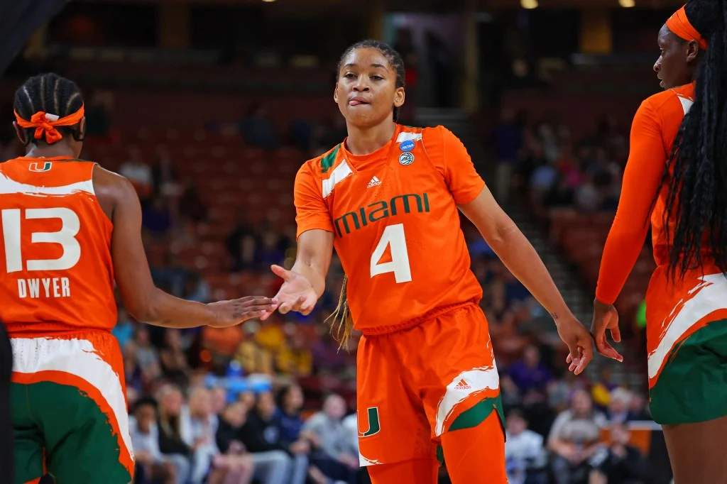 Jasmyne Roberts #4 of the Miami Hurricanes celebrates with Lashae Dwyer #13 of the Miami Hurricanes after a play against the Villanova Wildcats in the Sweet 16 round of the NCAA Women's Basketball Tournament at Bon Secours Wellness Arena on March 24, 2023